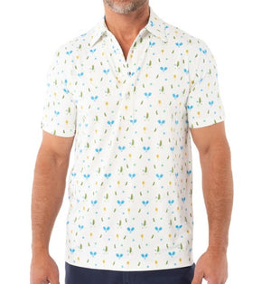 A man wears the CRIQUET Performance Sport Range Polo in white with a blue and yellow pickleballer print, standing against a plain background. This breathable men's polo is perfect for golf or any occasion.