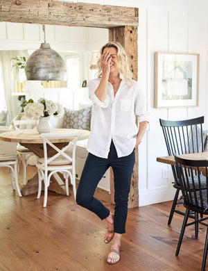The FRANK & EILEEN Murphy Billion Dollar Pant in black, featuring a tailored waistband and side pockets, is displayed flat on a white textured background.