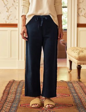The FRANK & EILEEN BELLA ITALIAN SWEATPANT is a light beige, wide-leg knit pant with a drawstring waist and subtle side trim, shown flat on a white background.