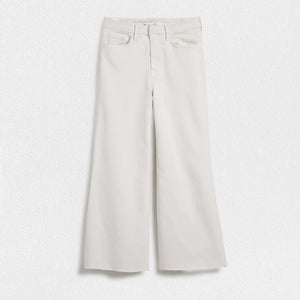 A pair of wide-leg fit jeans in a natural color from FRANK & EILEEN's GALWAY GAUCHO JEAN collection is displayed against a white textured background. Dubbed the Italian Dream Denim, these jeans feature a high waist, two front pockets, and two back pockets, with belt loops and a button and zipper closure.