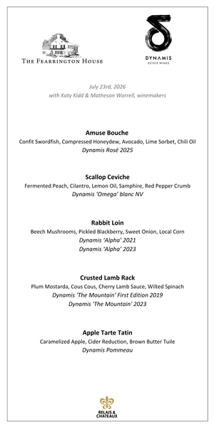 Enjoy a Dynamis Wine Dinner by FEARRINGTON VILLAGE, inspired by the lush Dynamis Estate in North Carolina’s Swan Creek—vineyards nestled among rolling hills and dense forests, with grapevines lining the landscape under bright blue skies.