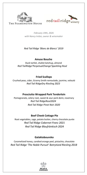 A metal sign reading "red tail ridge" with a tree and bird sculpture stands on grass at sunset—an inviting welcome to the Red Tail Ridge Wine Dinner by FEARRINGTON VILLAGE, perfect for a Finger Lakes wine experience.