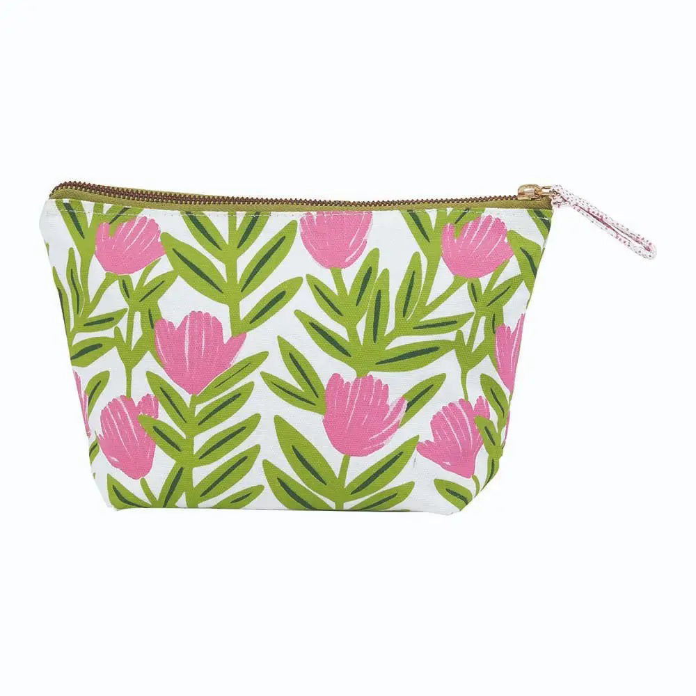 The ROCKFLOWERPAPER PINK DELIGHT POUCH is a zippered cotton canvas organizer with pink flowers and green leaves on white—perfect for storing your essentials.