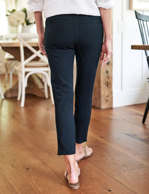 The FRANK & EILEEN Murphy Billion Dollar Pant in black, featuring a tailored waistband and side pockets, is displayed flat on a white textured background.
