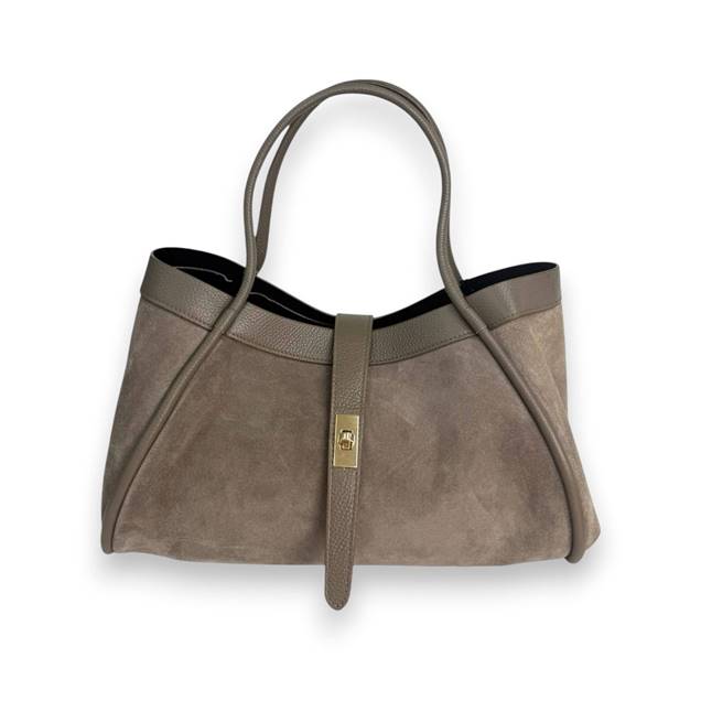 A taupe suede and leather handbag with two handles, gold clasp closure, and a structured, elegant design, displayed against a white background.