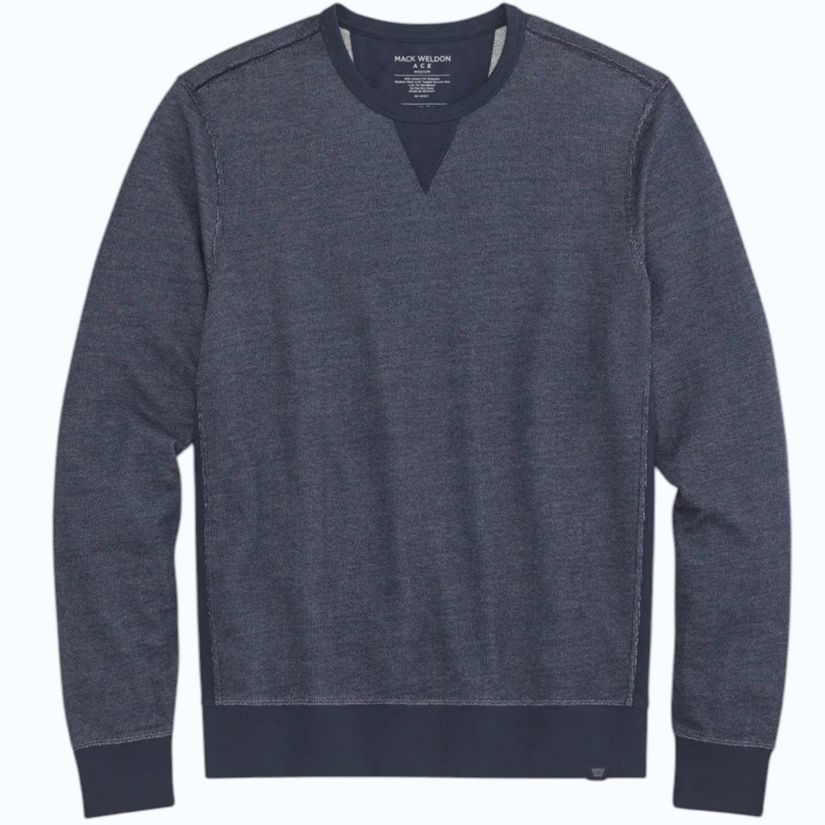 The MACK WELDON Ace Crew Neck Sweatshirt in True Navy Bird’s Eye features long sleeves, a streamlined fit, navy ribbed trim, soft French terry fabric, visible stitching details, and a small label at the bottom hem.