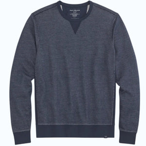 The MACK WELDON Ace Crew Neck Sweatshirt in True Navy Bird’s Eye features long sleeves, a streamlined fit, navy ribbed trim, soft French terry fabric, visible stitching details, and a small label at the bottom hem.