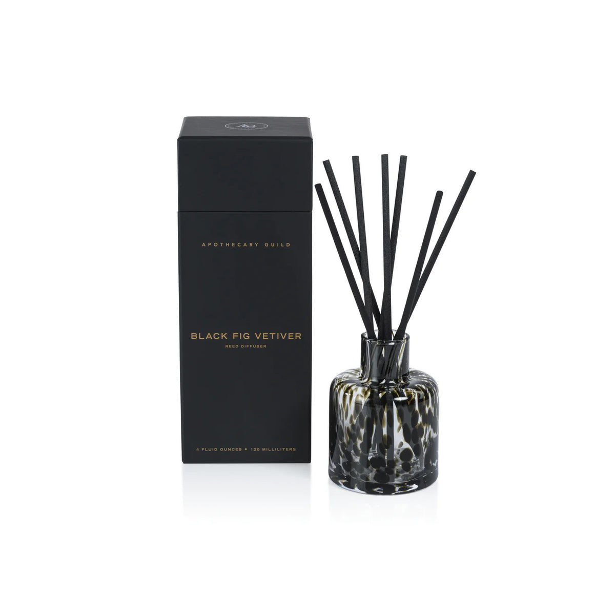 The Zodax Apothecary Guild Opal Glass Reed Diffuser – Black Fig features black and white patterned glass with black reeds, presented in a tall black box—an elegant home fragrance accent.