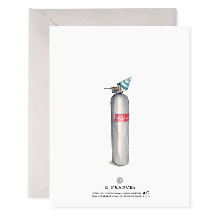 The E. FRANCES PAPER Helium 50 Birthday Card features silver balloon numbers "50" and the phrase "Cheers to a phenomenal new decade!" in gold, making it the perfect festive balloon birthday card. A light grey envelope is positioned behind the card, set against a clean white background.