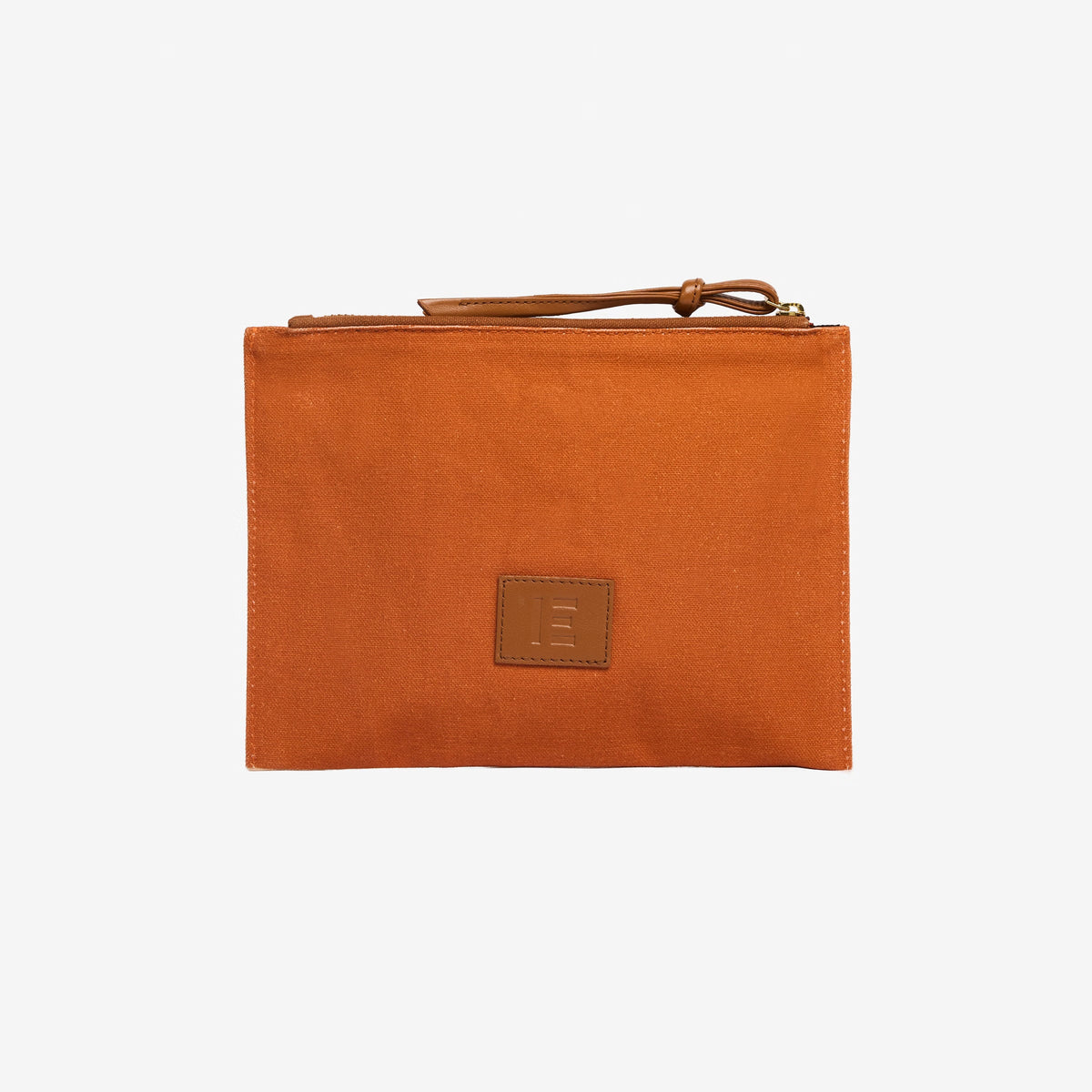 The INOUI Editions Embroidered Pouch Paris 9th Arrondissement by INOUI showcases stacked and open books, a tiny horse figurine, and a “NOUI EDITIONS” ribbon on beige fabric. It features a brown zipper with an Italian leather pull tab.