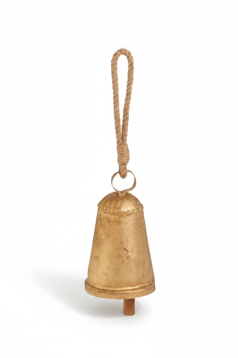 A weathered, 6″ H by 3.5″ D RUSTIC GOLD BELL 6″ made of gold-toned metal hanging from a jute rope loop.
