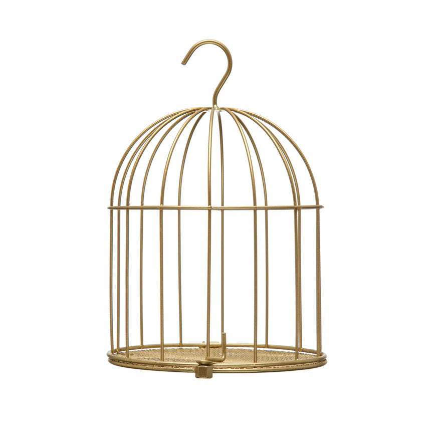 The METAL BIRD CAGE ORN by CREATIVE COOP features a golden finish with vertical bars and a domed top. Designed with a hook for hanging and a small latch-door at the bottom front, this elegant ornament stands gracefully on its base against a plain white backdrop.