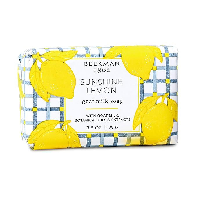 A 3.5 oz BEEKMAN - SUNSHINE LEMON BAR SOAP by BEEKMAN - STA ELEMENTS, wrapped in blue and white checkered paper with Meyer lemons, features ultra-hydrating goat milk, botanical oils, and extracts.