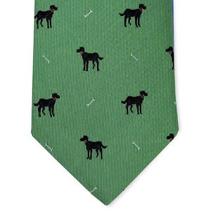 A rolled-up BIRD DOG BAY Black Lab Silk Tie in Mint, featuring a pattern of small black dogs and white bones evenly spaced across the woven silk, crafted in the signature style of BIRD DOG BAY.