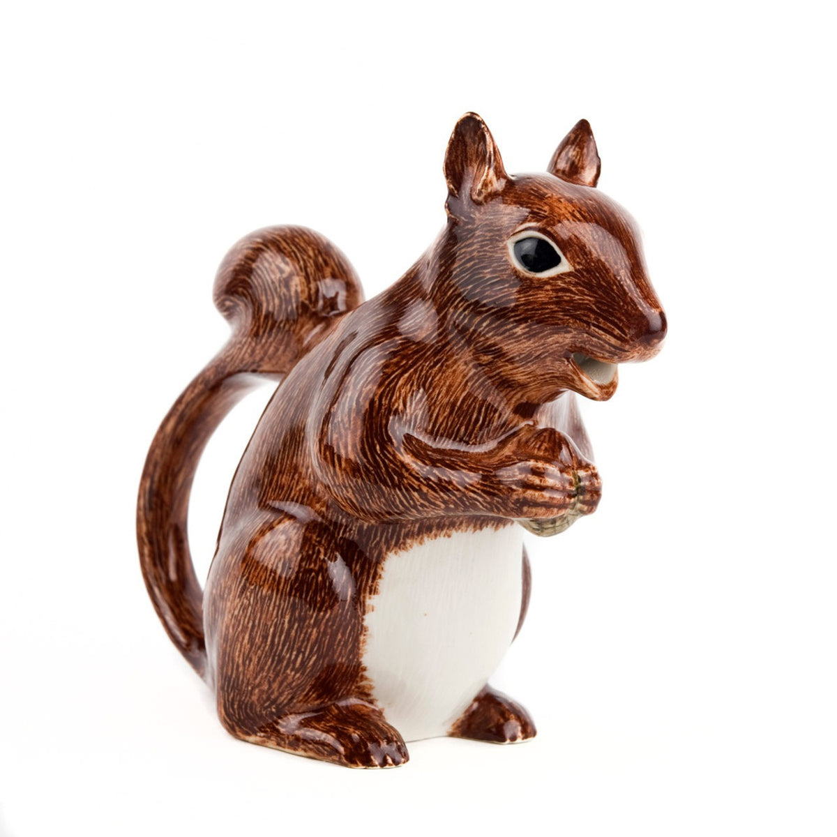 The QUAIL CERAMICS - SQUIRREL JUG by QUAIL DESIGNS is a hand-painted stoneware figurine depicting a brown squirrel with a white belly, standing upright and holding its paws together against a plain white background.