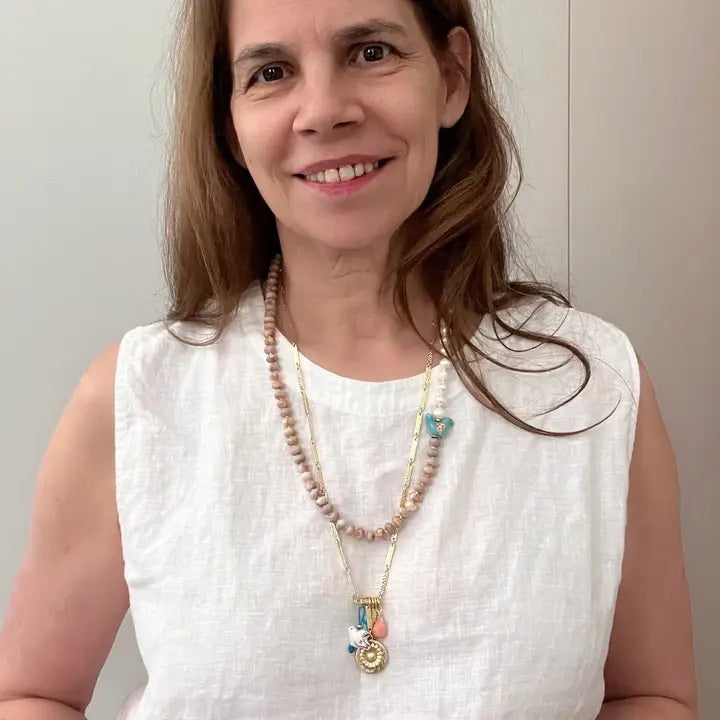 The GEMMA NECKLACE by SANDRINE FRANCE STUDIO features alternating freshwater pearls, round Red Vein Jasper beads, a blue ceramic bird bead, and a gold clasp. Handmade in NYC and shown against a plain white background.