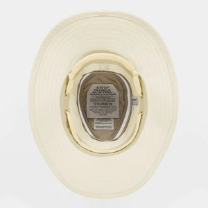 The TILLEY AIRFLO BROAD BRIM HAT LTM6 in Light Stone is a recycled nylon sun hat with UPF 50+ protection, wide brim, mesh ventilation near the crown, and a small band tag. Shown on a plain white background.