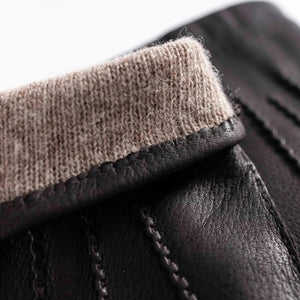 AMANDA CHRISTENSEN - LEATHER GLOVES WITH WOOL LINING IN BROWN: pair of dark brown goatskin leather gloves with a turned-down tan wool lining.