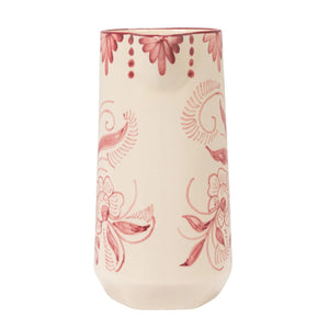 The HAND-PAINTED STONEWARE PITCHER WITH BOTANICAL DESIGN by CREATIVE COOP features a white ceramic finish, handle, and pink floral and swirl patterns with decorative dots, capturing charming cottagecore style on a plain background.