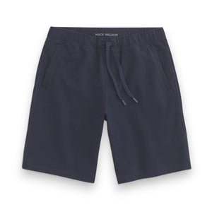 The MACK WELDON ACE Sweatshort 9" in navy features French terry fabric, side pockets, an elastic waistband, a tailored fit, and inner "Mack Weldon" branding—all laid flat on a white background for a polished look.