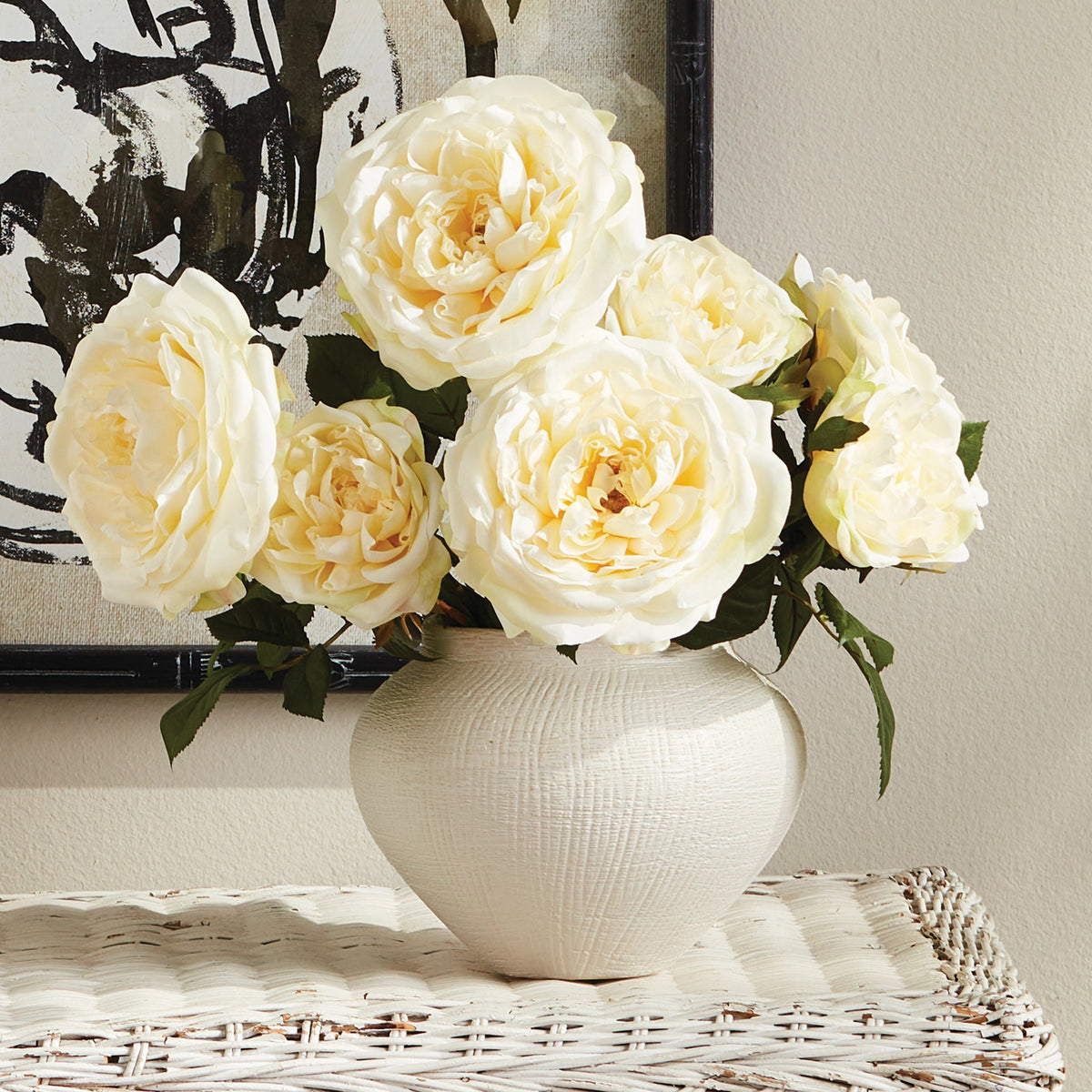 The NAPA HOME AND GARDEN - ENGLISH ROSE STEM features two large, pale peach roses with life-like petals and lush green leaves, tied with a natural raffia ribbon against a plain white background.