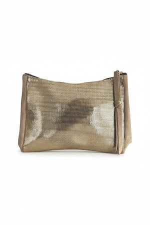 A gold metallic OLIVEVE Camila clutch with Italian leather-backed suede, featuring a subtle texture and shine. It has a teardrop gusset design and zip closure, showcased against a white background with an elegant silhouette.