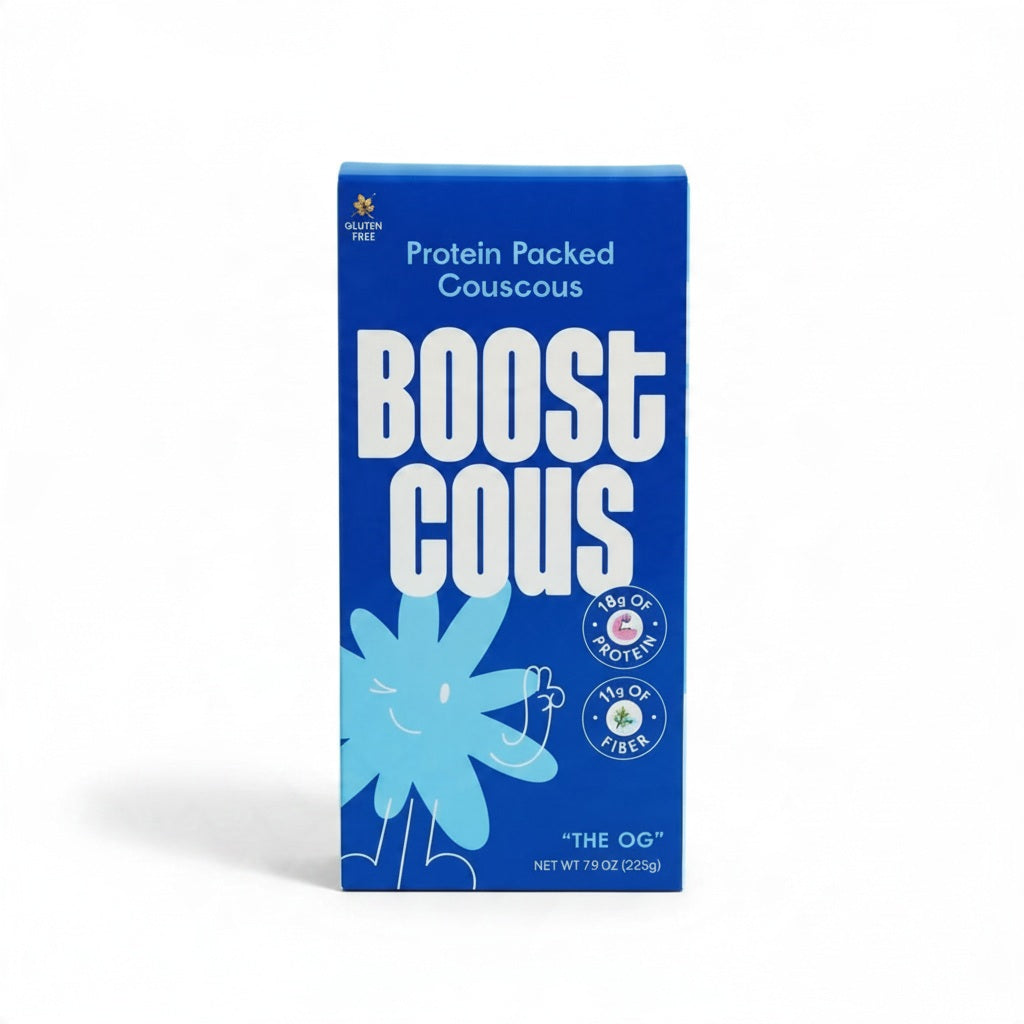 Blue box of BOOSTCOUS - BLUTEN FREE PROTEIN COUCOUS featuring a blue flower graphic and text stating “18g of protein” and “11g of fiber.”