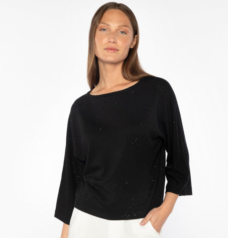 The KINROSS CASHMERE - SEQUIN EASY CROP PULLOVER by KINROSS features a light beige knit with subtle silver threads for an elegant, versatile shimmer, embodying sophisticated casual wear with its modern chic design and detailed pattern.