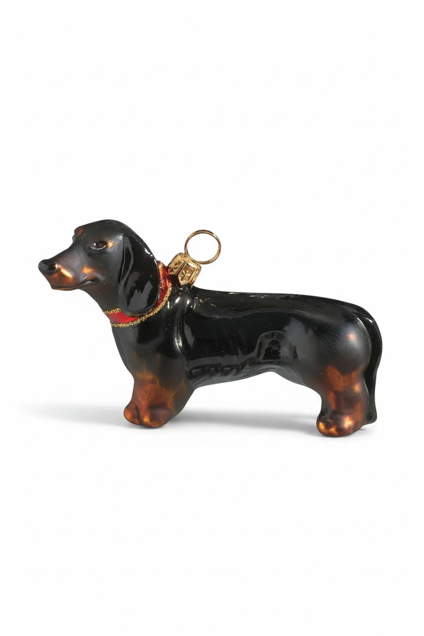 DACHSUND ORNAMENT by Joy to the World Collectibles featuring a handmade glass dachshund with a black and tan coat and a red collar.