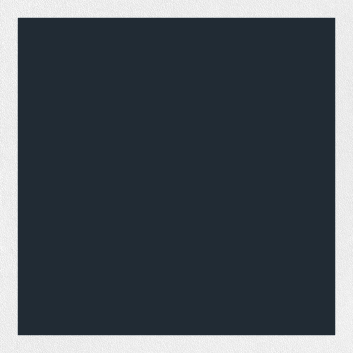 A woman with long blonde hair is wearing a black, short-sleeved MEIMEIJ - Flutter Sleeve Blouse and white pants with a black floral pattern. She is standing against a plain, light-colored background. Her face is not visible in the image.