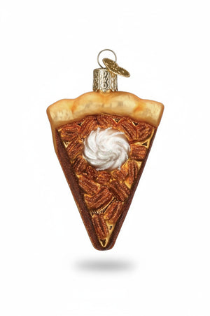 An OLD WORLD CHRISTMAS PECAN PIE ORNAMENT shaped like a slice of pecan pie topped with a dollop of whipped cream, hanging from a Christmas tree as a festive holiday dessert.