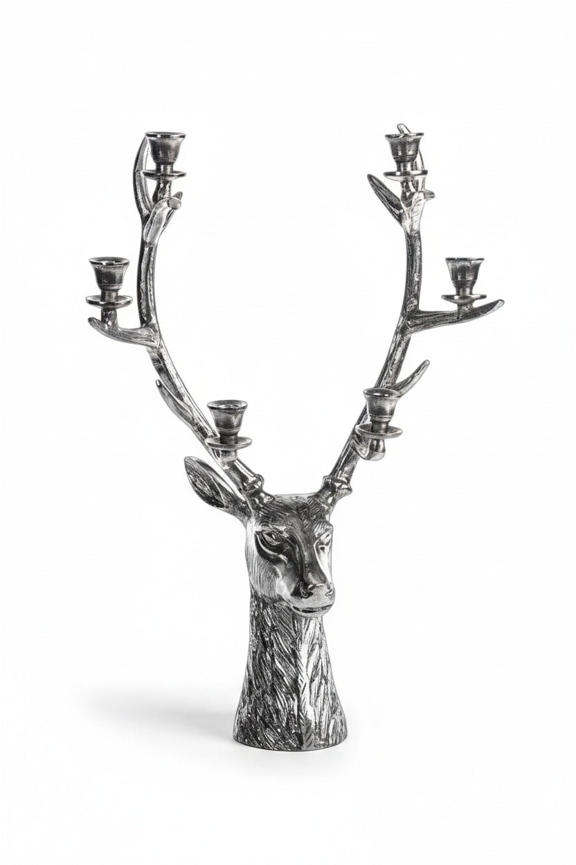 STAG HEAD 6 TIER CANDLEHOLDER IN SILVER ANTIQUE, a silver-toned alloy deer head statue featuring six candle holders positioned along its 16 in x 8 in x 24 in antlers.