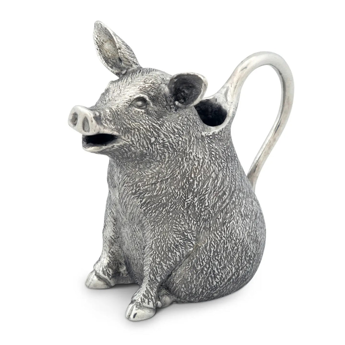 The VAGABOND HOUSE - PEWTER HAPPY PIG CREAMER, made from luxury-grade pewter, features pointed ears and detailed design. Its handle stretches from the back, revealing milk inside. This elegant piece by VAGABOND HOUSE sits on a plain white background.
