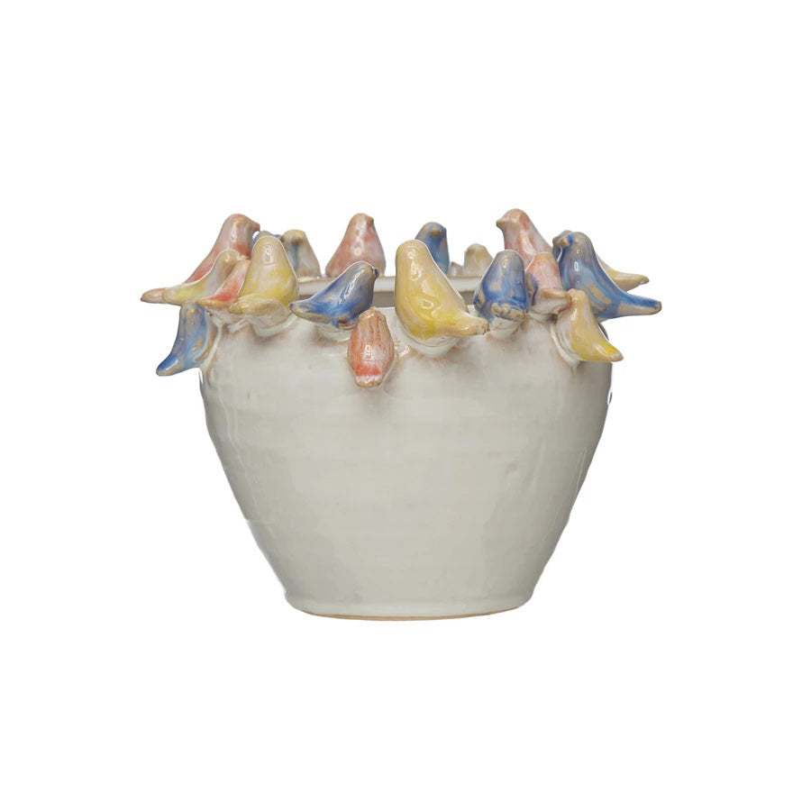 The PLANTER W BIRDS ON RIM by CREATIVE COOP is a ceramic piece made entirely from stoneware, showcasing a smooth, white exterior with small pastel-colored bird sculptures—yellow, pink, and blue—gracefully adorning the rim.