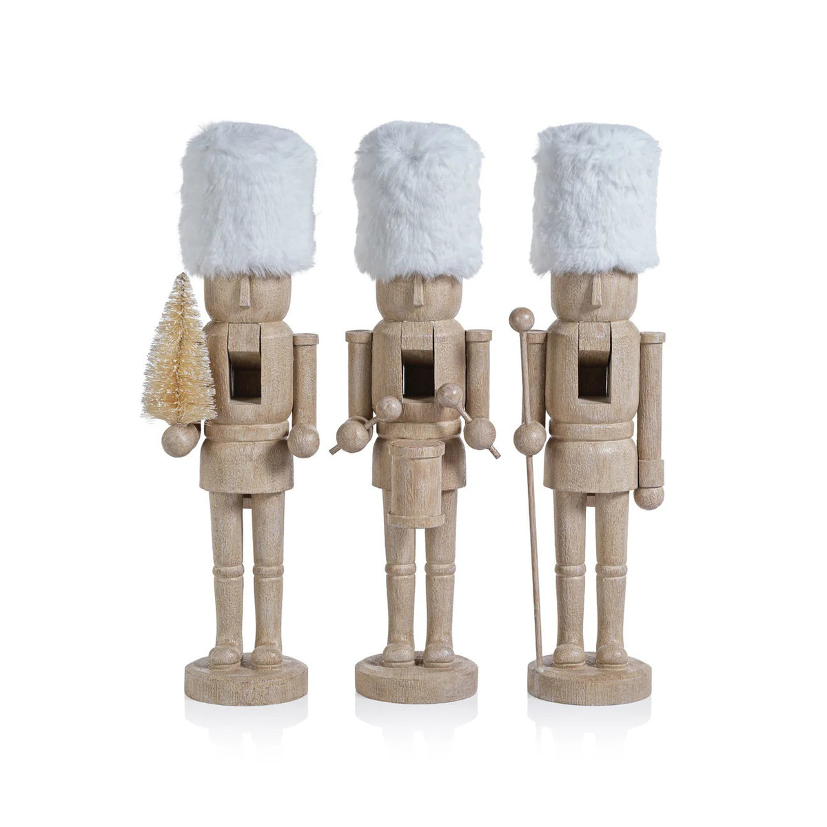 ZODAX RESIN NUTCRACKERS WITH FUR HATS: Three figurines in a natural finish, one with a bottle brush tree, another with a staff, and the third at its sides—perfect for home decor.