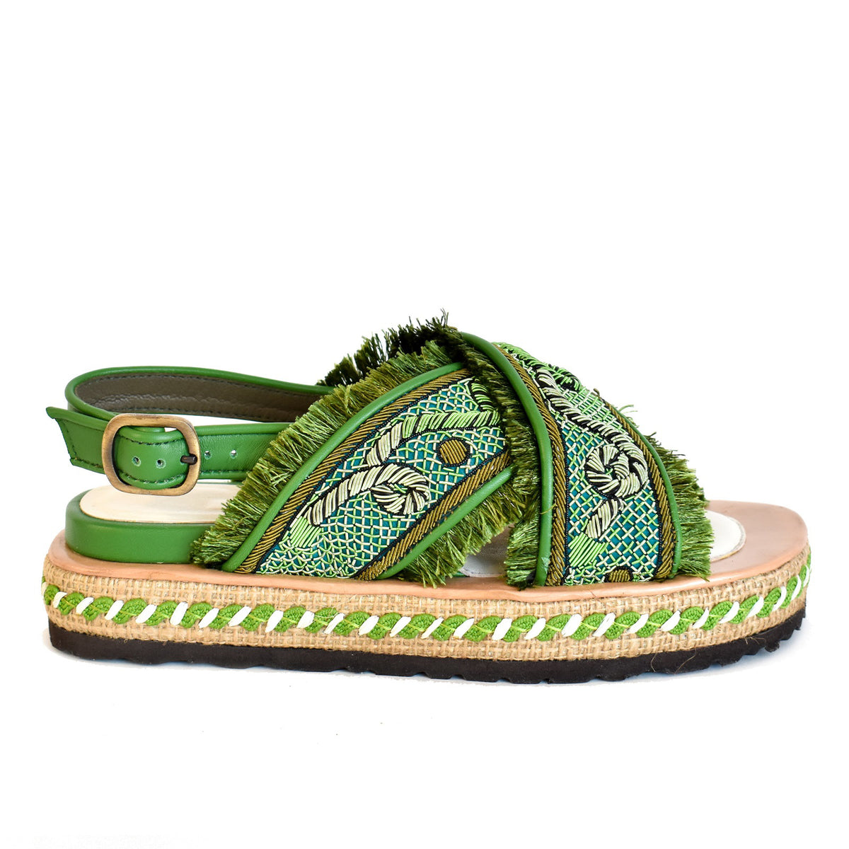 Explore the MEHER KAKALIA DA GAMMA BLOC sandal in Kelly Green Parrot, where comfort meets style. This open-toe sandal has a hand-embroidered design with fringe detailing, a thick textured sole with woven accents, an adjustable ankle strap, and a layered platform design.