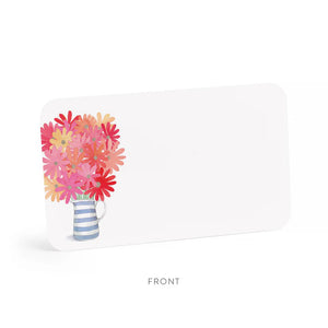 A clear plastic box of E. FRANCES PAPER's "Freshly Picked Little Notes" contains 85 notecards, each featuring a watercolor bouquet of pink and red flowers in a blue and white striped mug, labeled "E. Frances 85 Little Notes - use unsparingly.