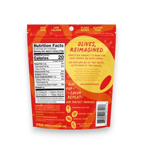A red package of FREESTYLE - HOT & SPICY GREEN OLIVES by FREESTYLE SNACKS features Calabrian chili-accented green olives. The design highlights olives, chilies, "All Natural," "Grown in Greece," and emphasizes "Healthy Snacking on the Go." Net weight: 4 oz (113g).