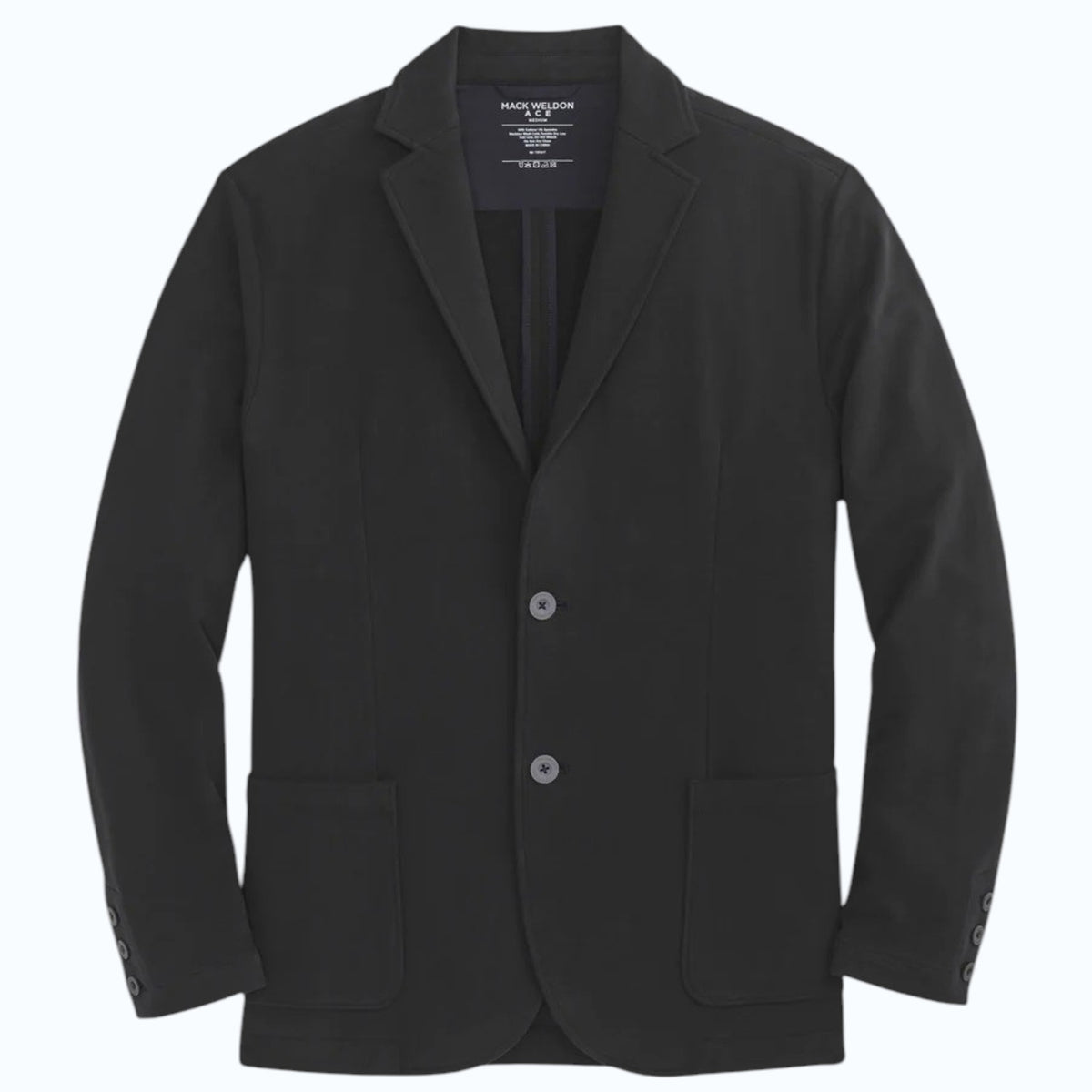 A person in a navy shirt holds open the MACK WELDON ACE BLAZER IN TRUE BLACK, revealing its comfortable, machine-washable design with an inside pocket and inner lining.