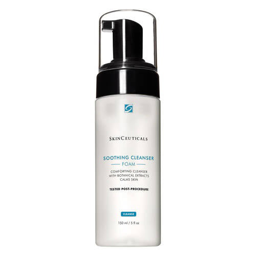 A 150 mL bottle of SKINCEUTICALS - SOOTHING CLEANSER FOAM from SKIN CEUTICALS. The bottle features a sleek white design with a black pump dispenser and a clear cap. The label emphasizes its calming properties with botanical extracts, making it ideal for sensitive skin, and specifies that it is tested post-procedure.
