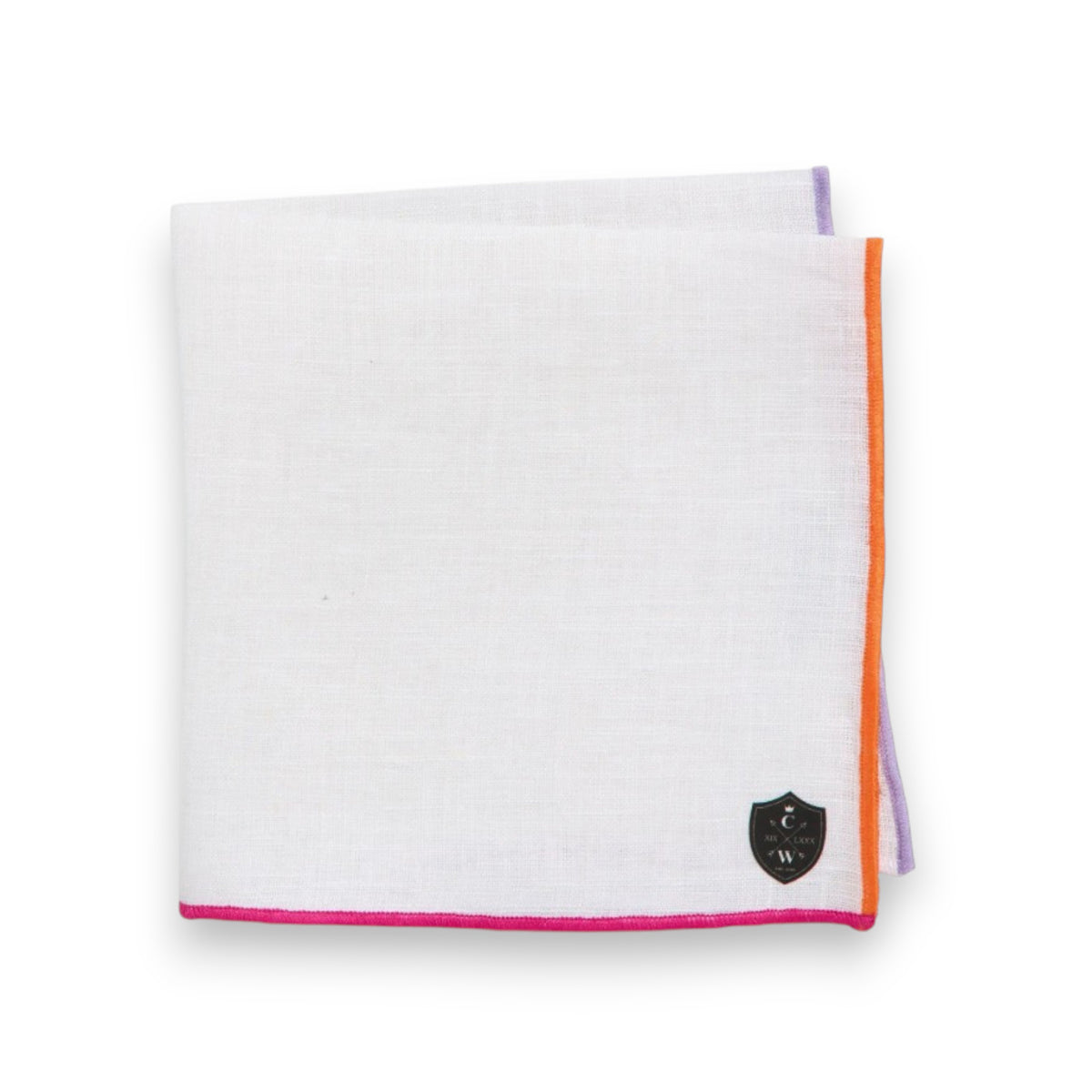 The CLIFTON WILSON White Windowpane Linen Pocket Square features colorful trim in pink, purple, and orange, plus a distinctive black shield logo in the corner.