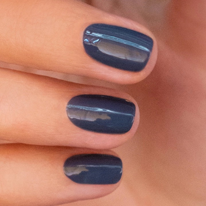 Discover MANUCURIST GREEN™ Nail Polish in Poppy Seed by MANUCURIST INC—featuring a vibrant, glossy shade inspired by blue nail polish swatches. This bio-sourced, non-toxic polish offers a chic and modern blue tone, ideal for those seeking a clean beauty alternative with a sophisticated finish reminiscent of both English and French-inspired hues.