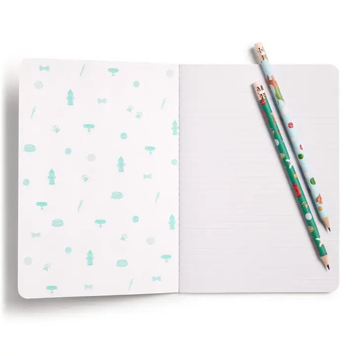 The E. FRANCES - STITCHED NOTEBOOKS OFF LEASH, SET OF 2 by E. FRANCES PAPER features one notebook with green stripes and a dog illustration, and another adorned with playful pups—perfect for pet lovers’ stationery needs.