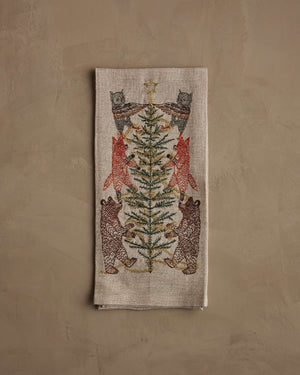 TINSEL TREE LINEN TEA TOWEL by CORAL & TUSK featuring embroidered owls, foxes, and bears decorating a tinsel tree for holiday decor.