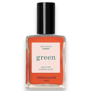 Close-up of glossy MANUCURIST - GREEN™ NAIL POLISH IN SUNSET from MANUCURIST INC, featuring smooth curves and luminous highlights that reflect light, showcasing this vibrant vegan shade.