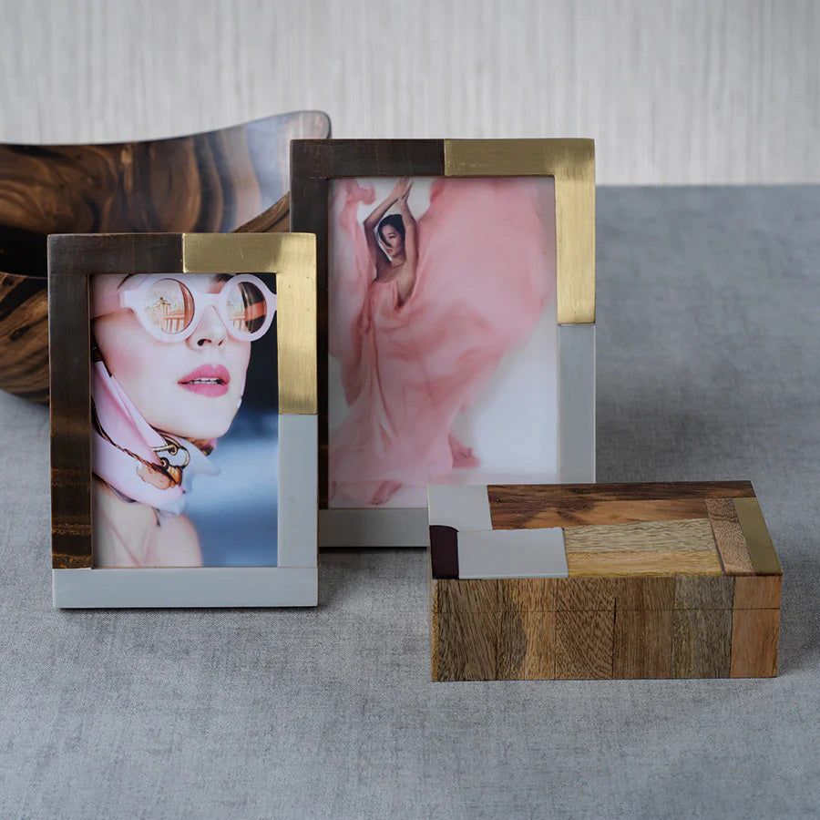 The ZODAX CAPE TOWN PHOTO FRAME - 4X6 features a modern rectangular design with brown wood, gold, and silver metal sections. This upright glass frame displays floral line art and the "ZODAX" logo.