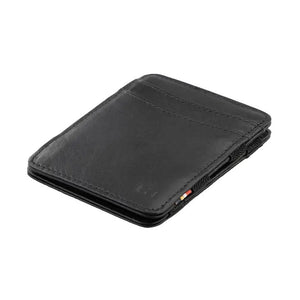 The GARZINI Magic Slim RFID-blocking leather wallet in black features multiple card slots and a sleek design, shown on a white background.