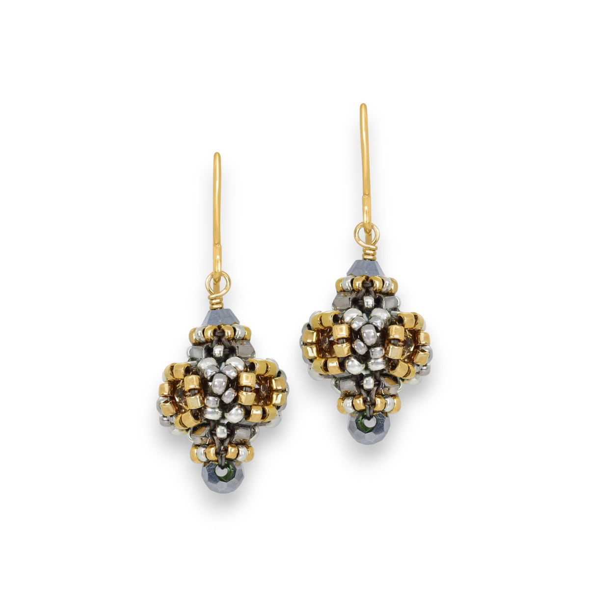 These elegant MIGUEL ASES - CRYSTAL MIYUKI PYRITE EARRINGS by MIGUEL ASES, INC. showcase intricate beadwork with Miyuki seed beads in gold, silver, and black hues, decorative patterns, gold hooks, and a small black bead at the bottom for a refined touch.