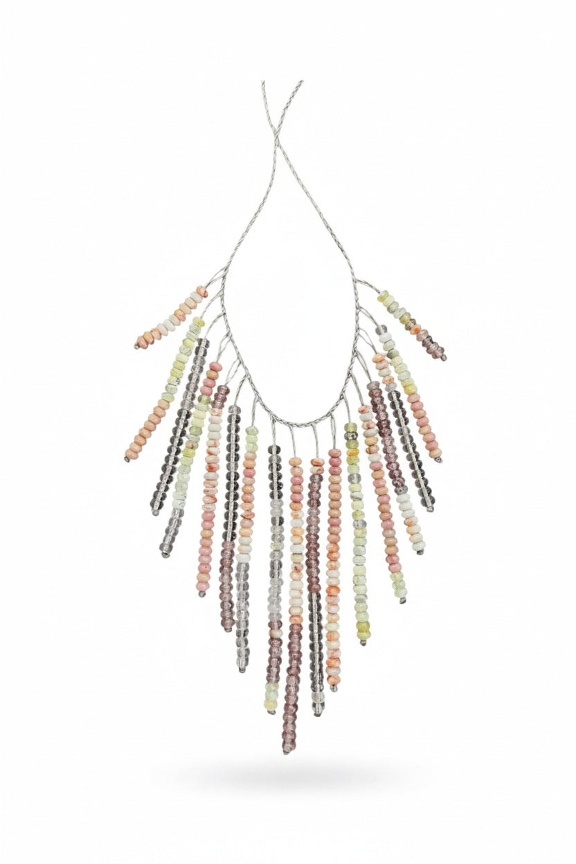 The ANN LIGHTFOOT Multi Gemstone Fringe Necklace features a silver chain with colorful gemstone fringe in pink, yellow, orange, green, and brown—perfect for adding playful charm to any look.