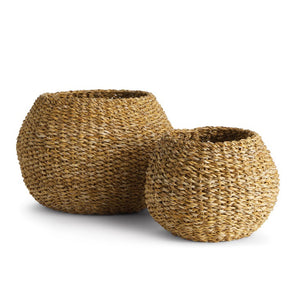 Two NAPA HOME AND GARDEN Seagrass Plant Baskets in different sizes sit side by side on a white background. Their natural, textured finish and wide openings are ideal for use as plant baskets or decor accents.